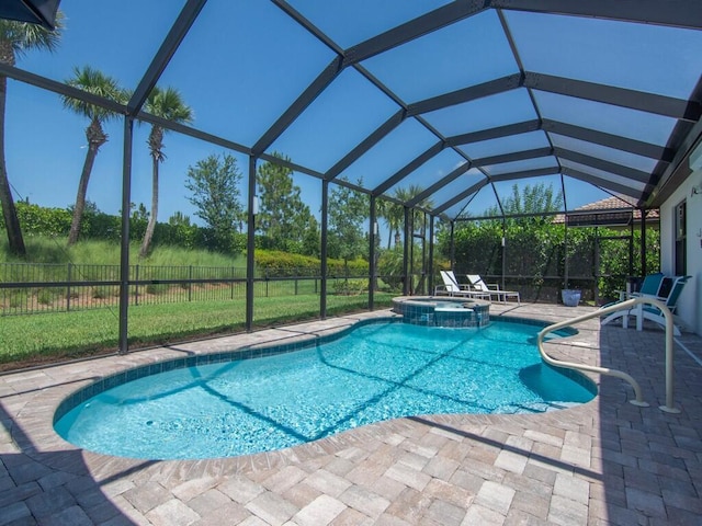 5082 Monroe Cir, Vero Beach, FL 32967 - view of swimming pool with a patio area, a pool with connected hot tub, and glass enclosure
