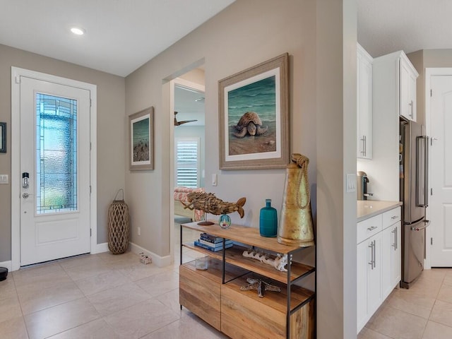 5082 Monroe Cir, Vero Beach, FL 32967 - foyer entrance with baseboards, light tile patterned flooring, a ceiling fan, and recessed lighting