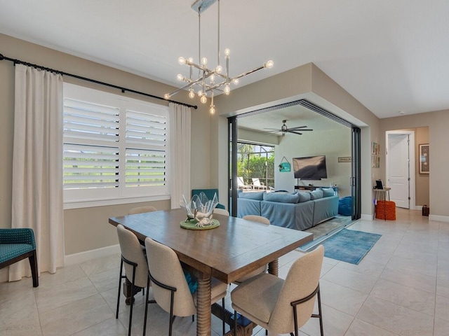 5082 Monroe Cir, Vero Beach, FL 32967 - dining room with light tile patterned floors, a chandelier, baseboards, and ceiling fan