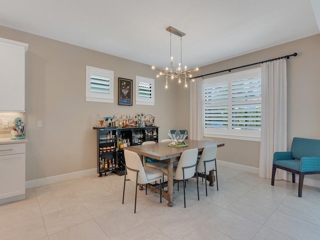 5082 Monroe Cir, Vero Beach, FL 32967 - dining room with healthy amount of natural light, light tile patterned flooring, and baseboards