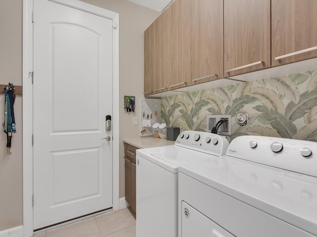 5082 Monroe Cir, Vero Beach, FL 32967 - laundry area with cabinet space, independent washer and dryer, and light tile patterned floors