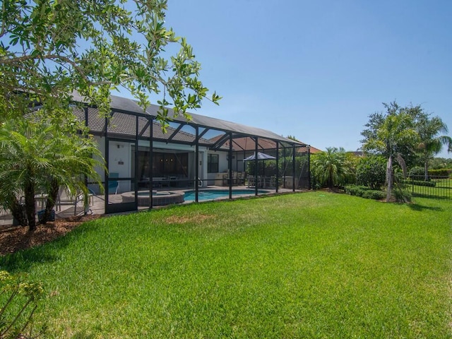 5082 Monroe Cir, Vero Beach, FL 32967 - view of yard featuring a pool with connected hot tub, glass enclosure, and a patio area