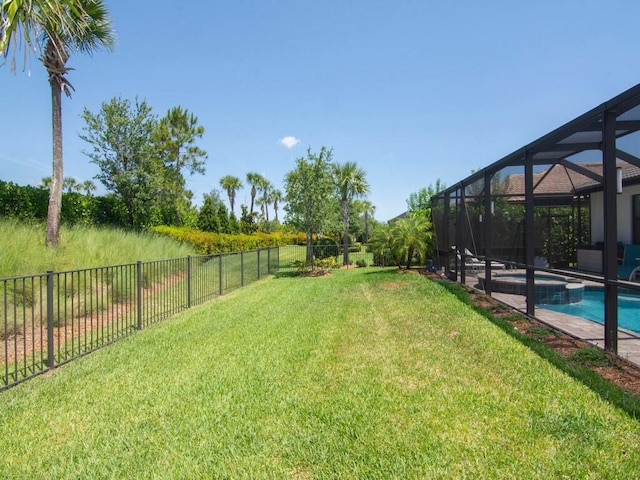 5082 Monroe Cir, Vero Beach, FL 32967 - view of yard featuring a pool with connected hot tub and glass enclosure