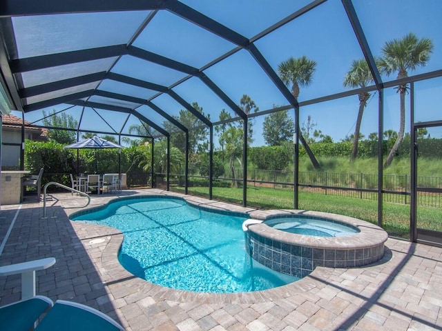 5082 Monroe Cir, Vero Beach, FL 32967 - view of pool with a patio area, a pool with connected hot tub, and glass enclosure