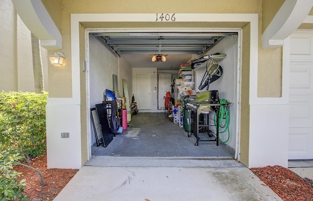 1406 W Wickham Cir Unit A, Delray Beach, FL 33445 - garage featuring a garage door opener
