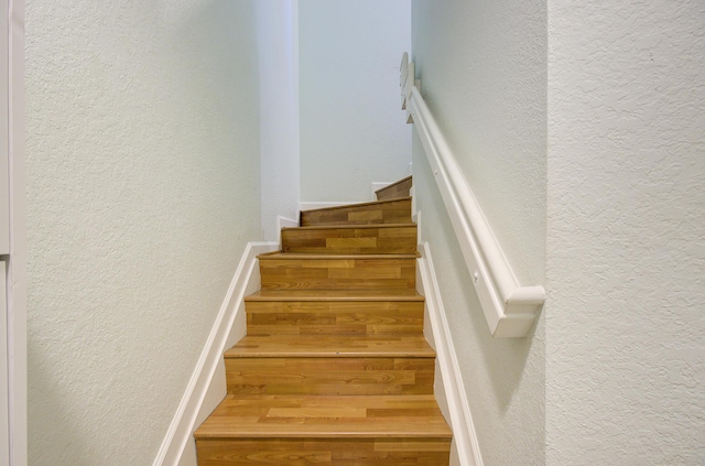 1406 W Wickham Cir Unit A, Delray Beach, FL 33445 - stairs featuring wood finished floors and a textured wall