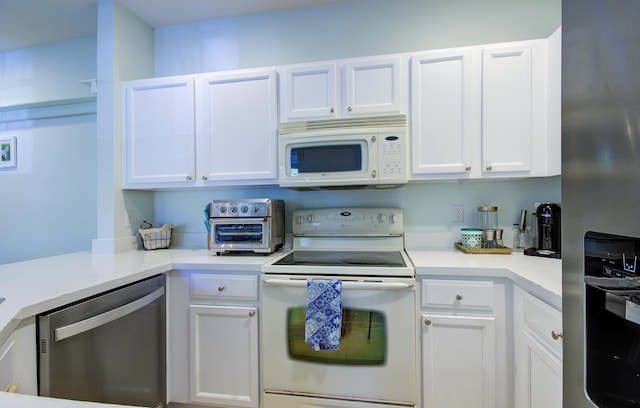 1406 W Wickham Cir Unit A, Delray Beach, FL 33445 - kitchen with appliances with stainless steel finishes, white cabinets, and light countertops