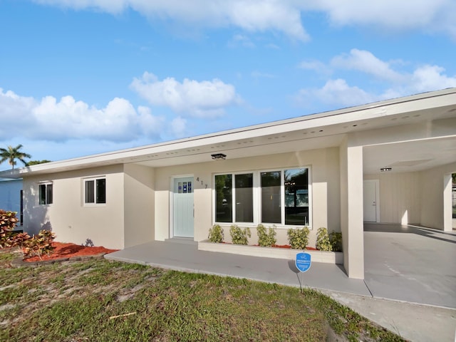 417 Philadelphia Dr, Jupiter, FL 33458 - rear view of house with stucco siding