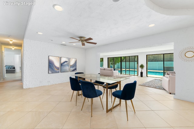 dining room featuring recessed lighting, a ceiling fan, a textured ceiling, light tile patterned flooring, and a textured wall