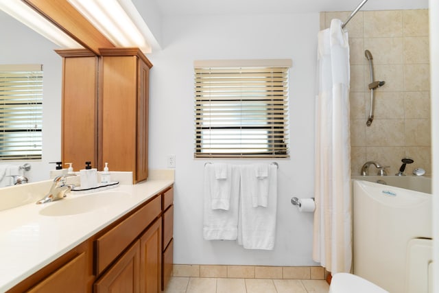 full bathroom with tile patterned floors, vanity, shower / tub combo, and toilet