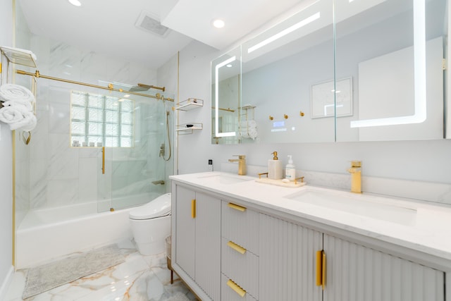 bathroom with marble tiled flooring, toilet, double vanity, recessed lighting, and shower / bath combination with glass door
