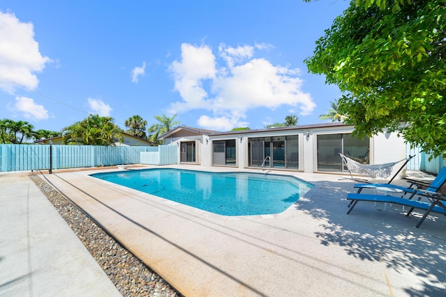 view of swimming pool with a patio