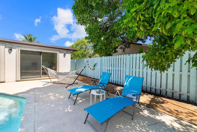 fenced backyard with a patio area