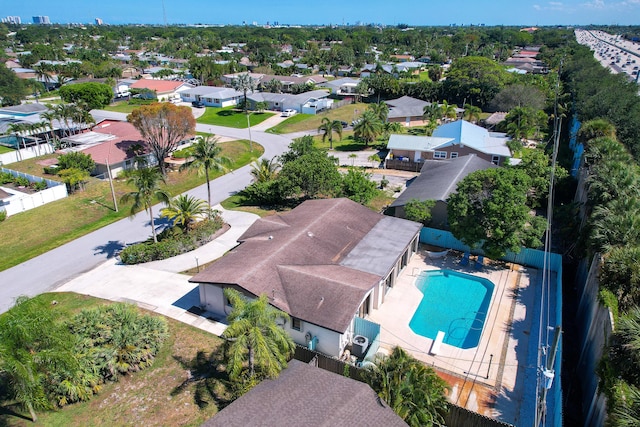 aerial view of residential area with a pool