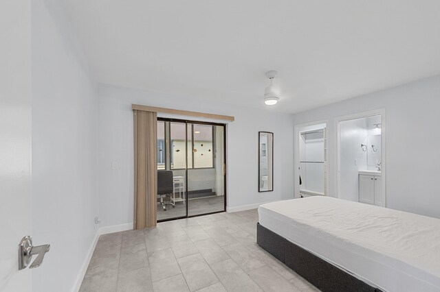 234 Capri E, Delray Beach, FL 33484 - bedroom with baseboards, ceiling fan, a desk, and access to exterior