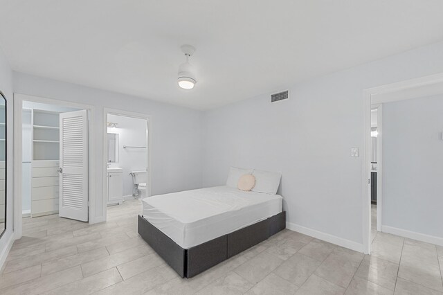 234 Capri E, Delray Beach, FL 33484 - bedroom featuring baseboards and ensuite bathroom