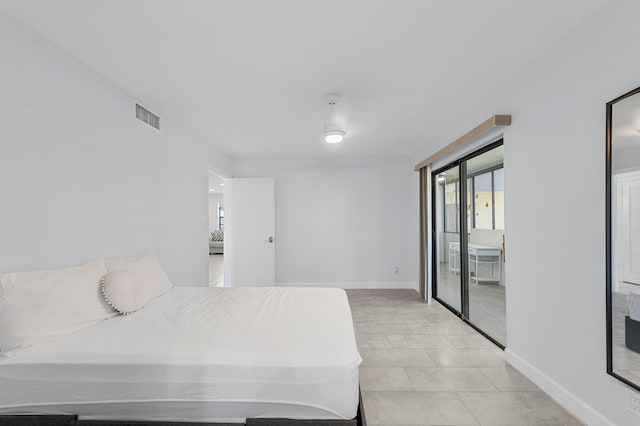 234 Capri E, Delray Beach, FL 33484 - bedroom featuring baseboards and access to outside