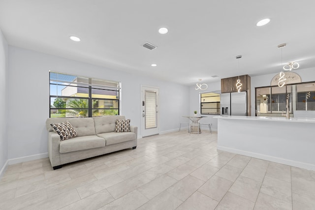 234 Capri E, Delray Beach, FL 33484 - living room with recessed lighting and baseboards