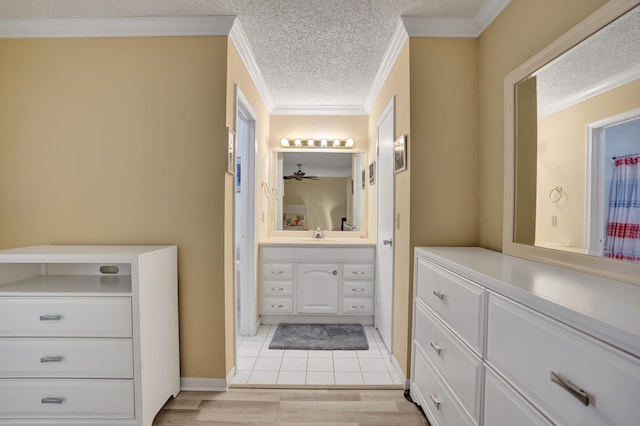 3647 SW Natura Ave Unit B, Deerfield Beach, FL 33441 - full bathroom with ornamental molding, vanity, a textured ceiling, ceiling fan, and baseboards