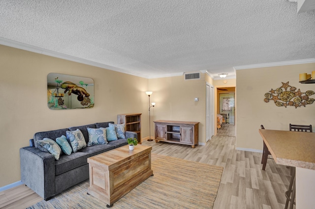 3647 SW Natura Ave Unit B, Deerfield Beach, FL 33441 - living area with light wood-style flooring, a textured ceiling, crown molding, and baseboards