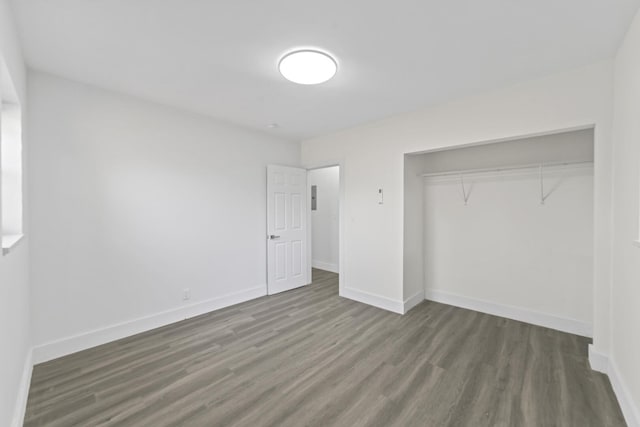 2232 SW 14th Ct, Fort Lauderdale, FL 33312 - unfurnished bedroom featuring wood finished floors, baseboards, and a closet