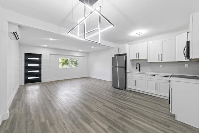 2232 SW 14th Ct, Fort Lauderdale, FL 33312 - kitchen featuring appliances with stainless steel finishes, a sink, a wall unit AC, dark wood-style floors, and open floor plan