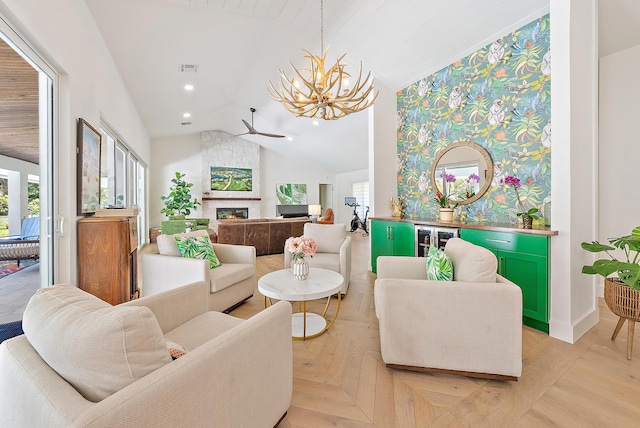 6799 Imperial Woods Rd, Jupiter, FL 33458 - living room with vaulted ceiling, a chandelier, a large fireplace, and recessed lighting