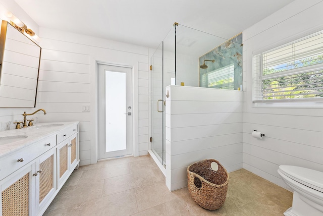 6799 Imperial Woods Rd, Jupiter, FL 33458 - full bathroom featuring a shower stall, double vanity, toilet, and tile patterned floors