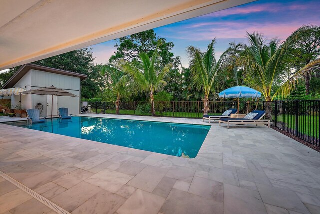 6799 Imperial Woods Rd, Jupiter, FL 33458 - pool at dusk with a patio