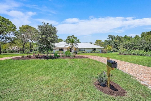 6799 Imperial Woods Rd, Jupiter, FL 33458 - ranch-style home featuring a front lawn