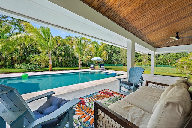 6799 Imperial Woods Rd, Jupiter, FL 33458 - swimming pool with a patio area, an outdoor hangout area, and ceiling fan