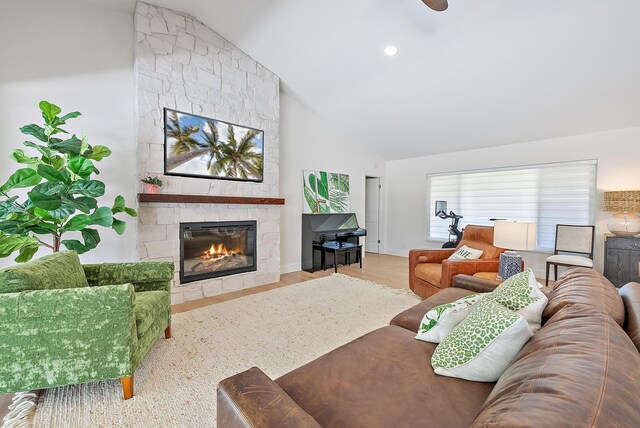 6799 Imperial Woods Rd, Jupiter, FL 33458 - living area with a fireplace, wood finished floors, high vaulted ceiling, and baseboards