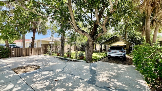 1120 S Federal Hwy, Lake Worth, FL 33460 - view of front of property featuring a detached carport, fence, and driveway