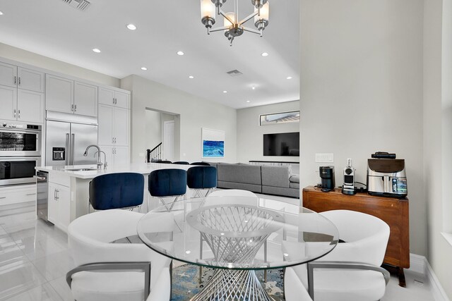 dining space with a chandelier and recessed lighting