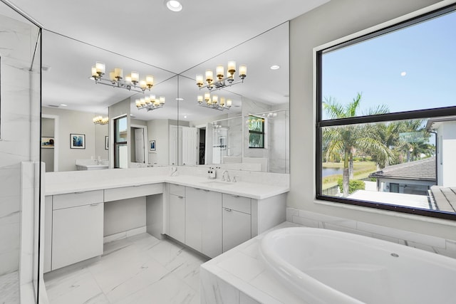 bathroom featuring a chandelier, a shower stall, a bath, vanity, and marble finish flooring
