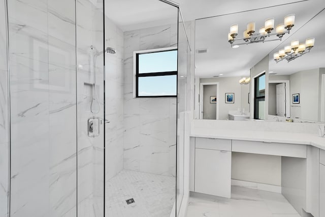 full bath with marble finish floors, a marble finish shower, vanity, and a chandelier
