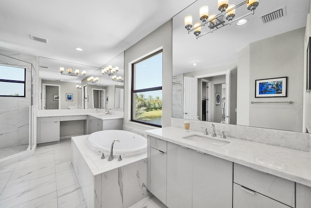 full bath with marble finish floors, a chandelier, a garden tub, a marble finish shower, and recessed lighting