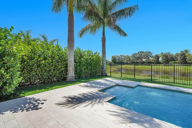 view of swimming pool with a patio