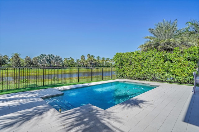 view of pool with a water view and a fenced backyard