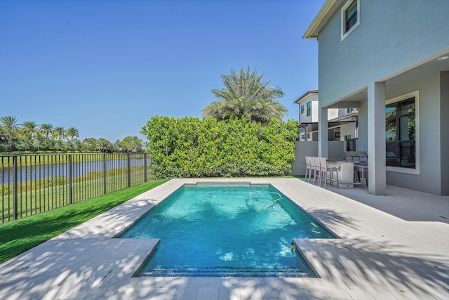 view of pool with a fenced backyard and a patio area