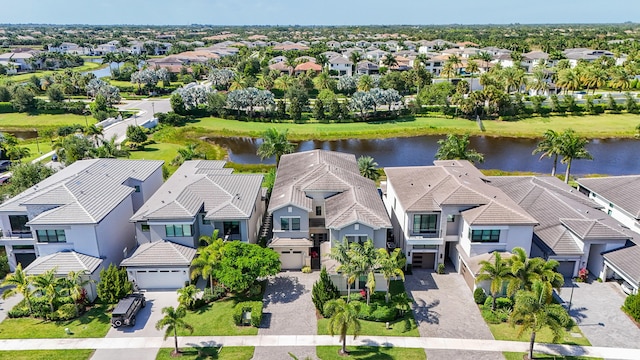 aerial view of residential area with a large body of water