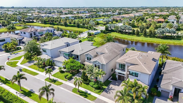 aerial view of residential area featuring a nearby body of water