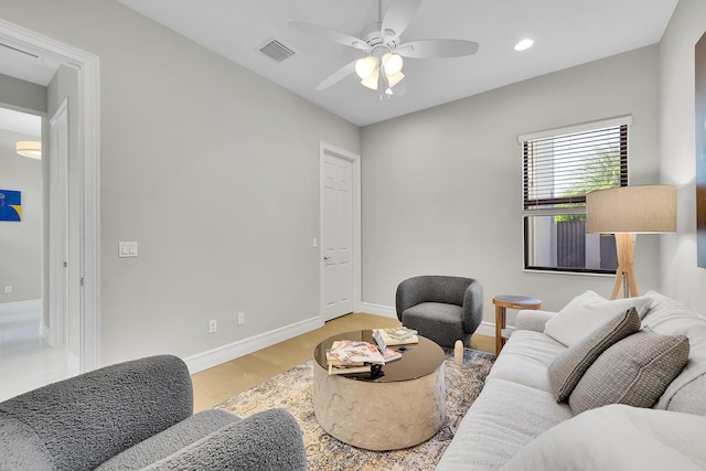 living area featuring ceiling fan, light wood-type flooring, recessed lighting, and baseboards