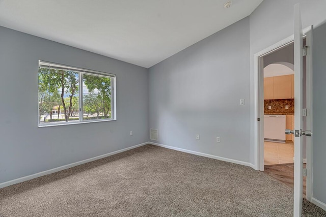3810 N Jog Rd Unit 204, West Palm Beach, FL 33411 - carpeted empty room with arched walkways, baseboards, and lofted ceiling