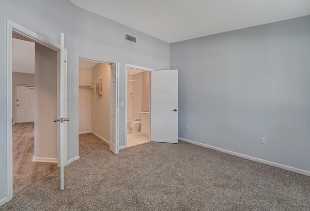 3810 N Jog Rd Unit 204, West Palm Beach, FL 33411 - unfurnished bedroom with carpet flooring, a spacious closet, and baseboards