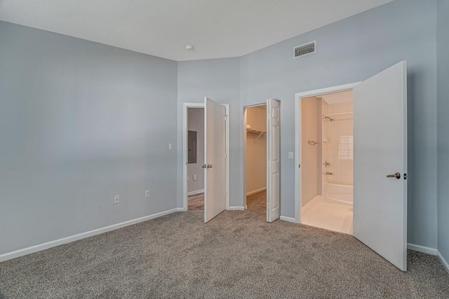 3810 N Jog Rd Unit 204, West Palm Beach, FL 33411 - unfurnished bedroom featuring carpet flooring, a spacious closet, baseboards, and a closet