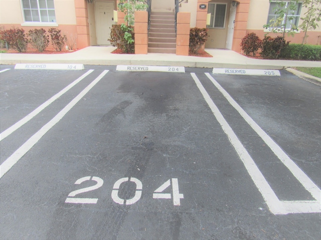 3810 N Jog Rd Unit 204, West Palm Beach, FL 33411 - uncovered parking lot with stairway