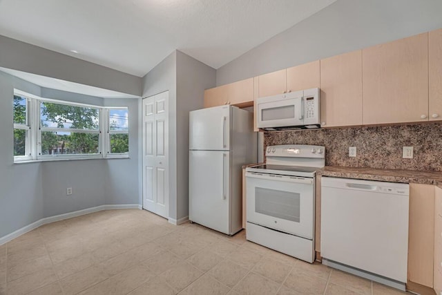 3810 N Jog Rd Unit 204, West Palm Beach, FL 33411 - kitchen with white appliances, lofted ceiling, tasteful backsplash, baseboards, and light brown cabinetry