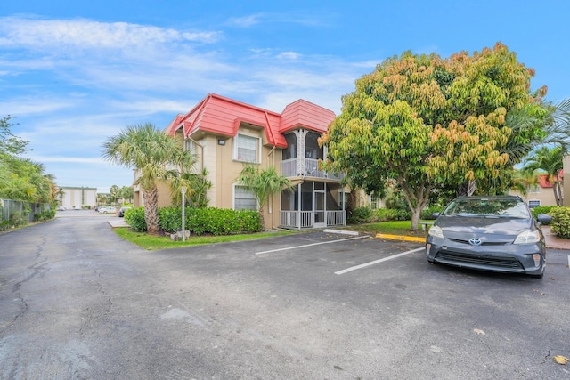 495 SE 8th St Unit 147, Deerfield Beach, FL 33441 - view of building exterior featuring uncovered parking