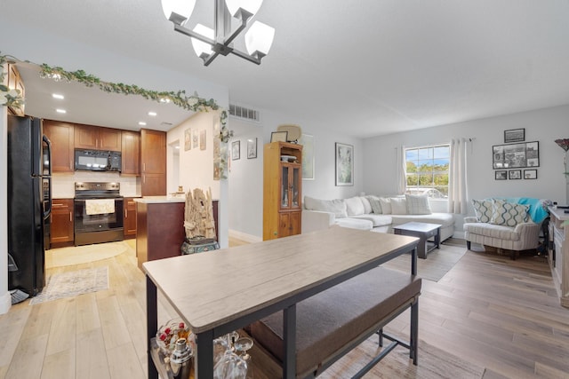 495 SE 8th St Unit 147, Deerfield Beach, FL 33441 - dining space with light wood-style floors, recessed lighting, and a chandelier